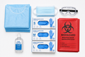 Osseus wall-mount PPE station fully stocked with gloves, masks, gowns, goggles and signage on white
