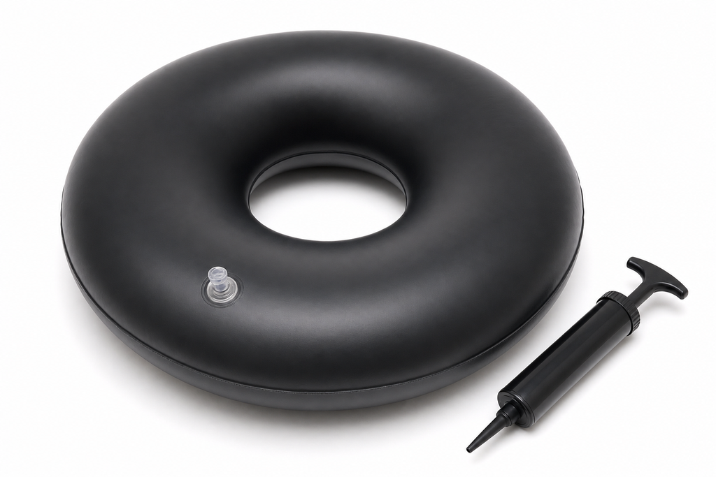 Inflatable donut ring cushion in dark blue with velvet cover and hand pump on white background