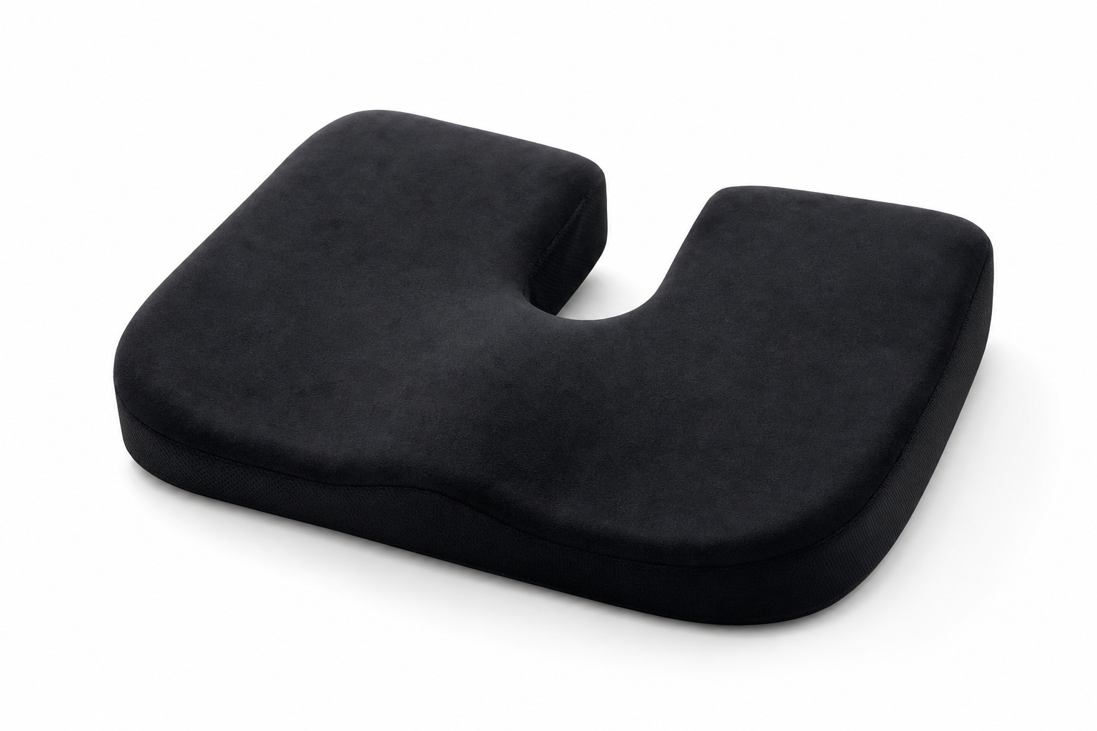 Black memory foam coccyx cushion with U-shaped tailbone cutout and carrying handle on white background