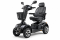 Premium black heavy-duty 4-wheel electric mobility scooter with captain's seat, LED lights, and chrome wheel hubs on white background